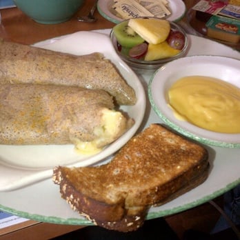 Cora's Breakfast & Lunch - Spinach cheddar crepe omelette with hollandaise on side. Made with a buckwheat crepe. And half of the multigrain toast. 11.75 - Breakfast & Brunch Near Me - Mississauga, Ontario Cora's Breakfast & Lunch - Spinach cheddar crepe omelette with hollandaise on side. Made with a buckwheat crepe. And half of the multigrain toast. 11.75 - Breakfast & Brunch Near Me - Mississauga, Ontario