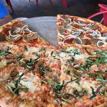 Home Slice Pizza - Half margarita half sausage pepperoni onion sooo good a slice got away before I could snap the pic - Pizza Near Me - Austin, Texas