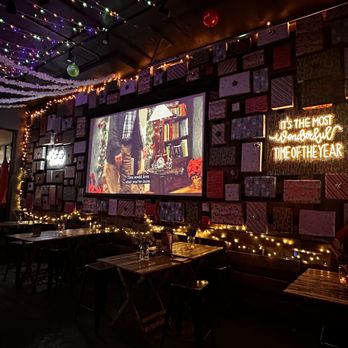 Urban Tree Cidery - a large screen in the middle of the room - Beer, Wine & Spirits Near Me - Atlanta, Georgia Urban Tree Cidery - a large screen in the middle of the room - Beer, Wine & Spirits Near Me - Atlanta, Georgia