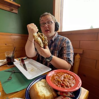 Chase Creek Smoke House - My son's giant burger on a pretzel bun. He also got chili instead of chips or fries. The chili came with a giant slice of bread. - Barbeque Near Me - Chase, Michigan
