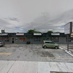 T & T Nails - Storefront. Limited parking.