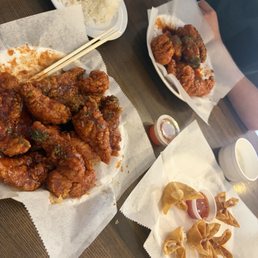 Yangnyeom chicken, spicy garlic chicken, side of rice and side of crab rangoons