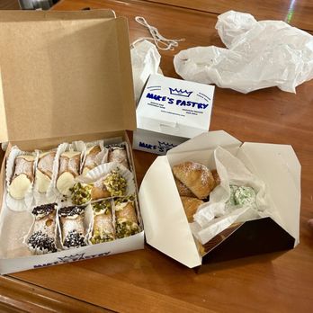 Mike's Pastry - Pistachio, chocolate chip, and plain mini cannolis with pistachio cookies and eclairs from Mike's bakery! Super fresh - Bakeries Near Me - Boston, Massachusetts