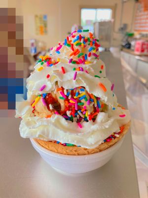 Photo of Calder Bros. Dairy - Lincoln Park, MI, US. Waffle bowl sundae with whipped cream and sprinkles. Wow!