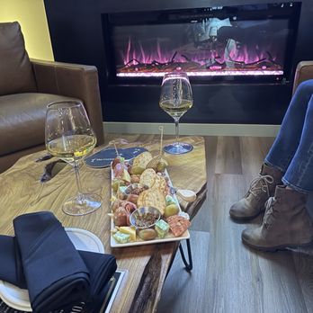 The Cortez - Charcuterie next to the fireplace - Cocktail Bars Near Me - Prescott, Arizona