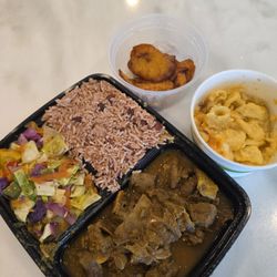Jamrocc - Curry Goat, Rice with beans, cabbage, mac and cheese, plantains. This food is absolutely delicious! The goat was so tender
