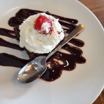 California Pizza Kitchen - It's hard to see past the whipped cream but that's a kid's brownie in there. - New American Near Me - Cockeysville, Maryland