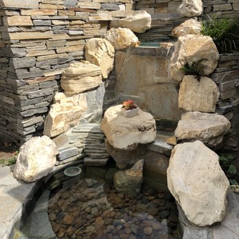 Newland Landscape - Before - Old dated waterfall - Landscaping Near Me