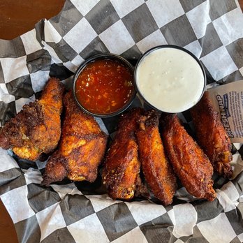 The Bulldog Lowertown - a basket of chicken wings with dipping sauce - Bars Near Me - St Paul, Minnesota