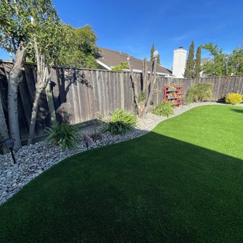 Green Works ATS - Had them removed the mulch along the perimeter and replaced with cobblestones - Artificial Turf Near Me Green Works ATS - Had them removed the mulch along the perimeter and replaced with cobblestones - Artificial Turf Near Me