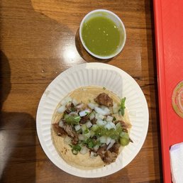 Carnitas taco with extra salsa Carnitas taco with extra salsa