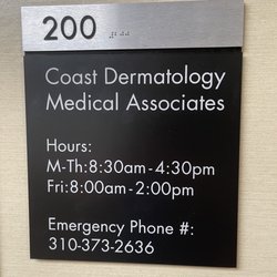 Coast Dermatology Medical Associates - Suite door with hours and emergency number.