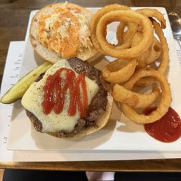 Russian Burger 8oz Angus beef burger with American cheese, coleslaw, & Russian dressing on a kaiser. Served with a pickle & chips $10.25 Russian Burger 8oz Angus beef burger with American cheese, coleslaw, & Russian dressing on a kaiser. Served with a pickle & chips $10.25