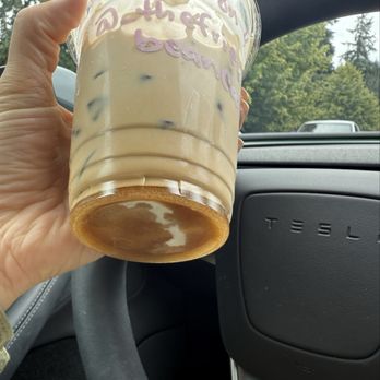 The Friendly Bean - Iced white chocolate americano with cream - white chocolate powder caked at bottom of cup - Coffee & Tea Near Me - Lakewood, Washington The Friendly Bean - Iced white chocolate americano with cream - white chocolate powder caked at bottom of cup - Coffee & Tea Near Me - Lakewood, Washington