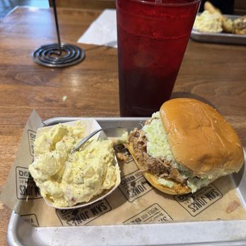 Sam Jones BBQ - The luncheon plate, pulled pork and slaw on potato bread with potato salad and iced tea - Barbeque Near Me - Winterville, North Carolina Sam Jones BBQ - The luncheon plate, pulled pork and slaw on potato bread with potato salad and iced tea - Barbeque Near Me - Winterville, North Carolina