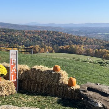 Apex Orchards - hay bales and pumpkins on a hill - Fruits & Veggies Near Me - Shelburne Falls, Massachusetts