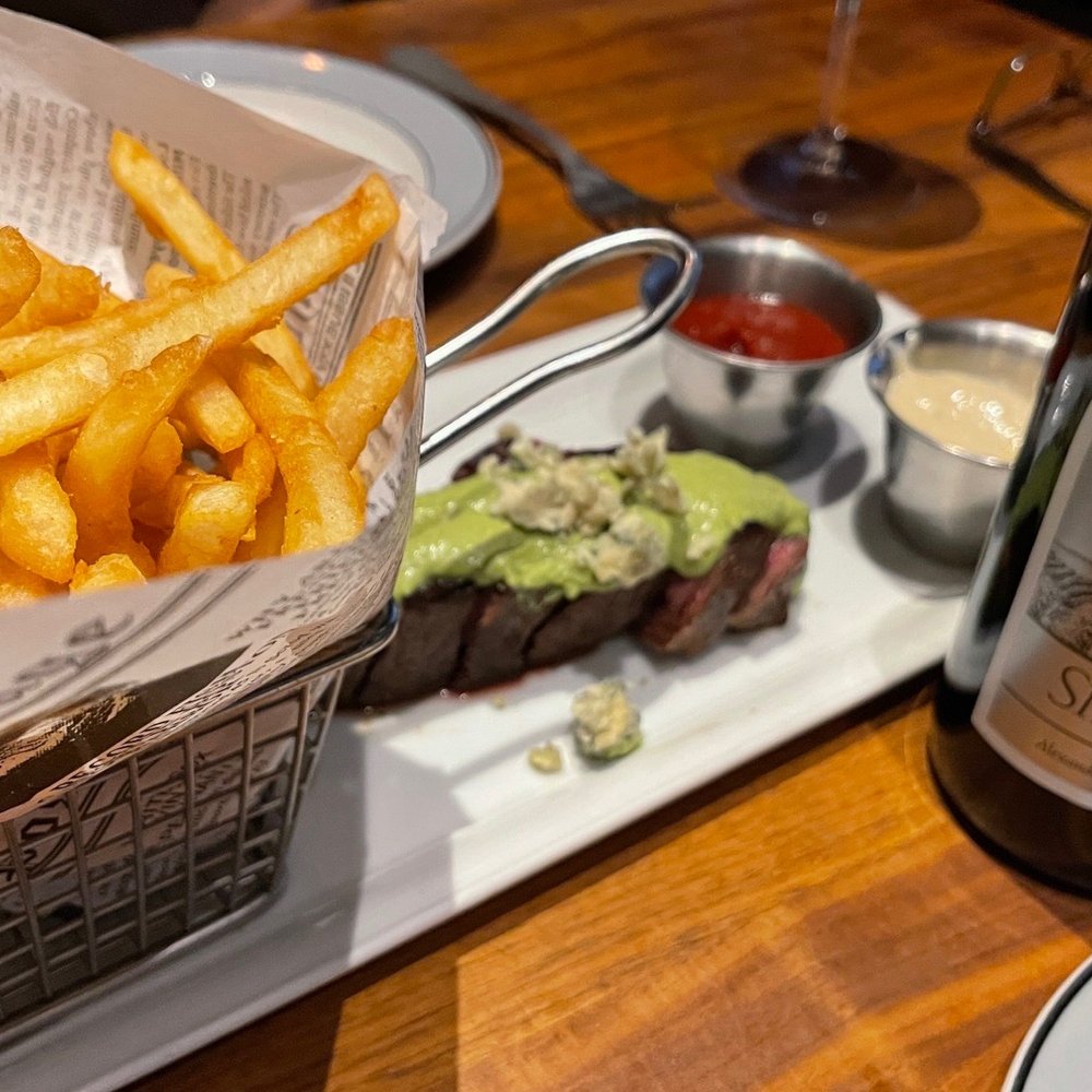 Lodge Kitchen - a basket of french fries and a bottle of wine - New American Near Me - Sunriver, Oregon Lodge Kitchen - a basket of french fries and a bottle of wine - New American Near Me - Sunriver, Oregon