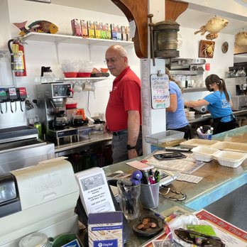 Gill's By The Bay - a man and a woman in a kitchen - Seafood Near Me - Eureka, California Gill's By The Bay - a man and a woman in a kitchen - Seafood Near Me - Eureka, California