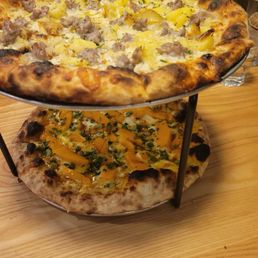 Sausage and potato pizza up top. Squash pizza below.