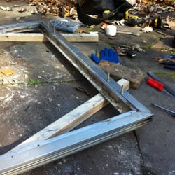 Glenbrook Patio Door - Putty glaze plate glass removal for roller replacement. Doors circa 1955-in Northbrook.