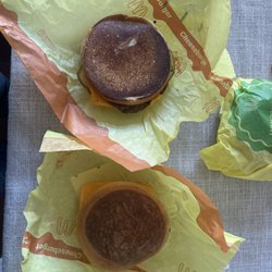 McDonald's - This is what you call a cheese burger? Taste terrible. Looks terrible. Asked for extra onions and got no onions at all.. thanks a lot.
