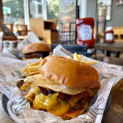Woodland Burger & Wings - Eggstraordinary Burger $8.49 - FRIED EGG, 2 STRIPS OF SMOKEY APPLE BACON,WITH 2 SLICES OF CHEDDAR CHEESE