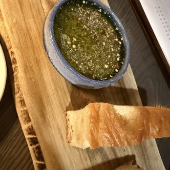 Trattoria Fondi - Warm focaccia with herbed olive oil - Italian Near Me - Bedford, New Hampshire Trattoria Fondi - Warm focaccia with herbed olive oil - Italian Near Me - Bedford, New Hampshire