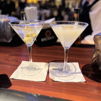 Wildfire - two martinis on a bar with a bartender in the background - American Near Me - Eden Prairie, Minnesota Wildfire - two martinis on a bar with a bartender in the background - American Near Me - Eden Prairie, Minnesota