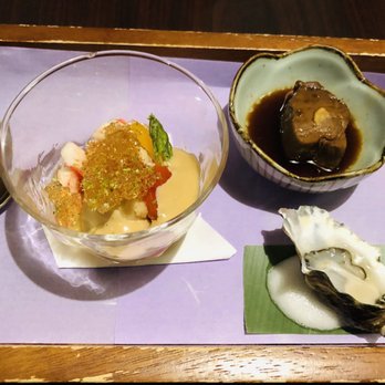 Shiro's - A plate cold dishes, local oyster, braised tuna and Alaska crab seaweed salad. - Sushi Bars Near Me - Seattle, Washington