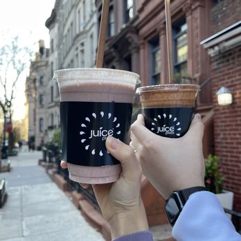 Juice Press - a person holding two cups of coffee - Juice Bars & Smoothies Near Me - New York, New York Juice Press - a person holding two cups of coffee - Juice Bars & Smoothies Near Me - New York, New York