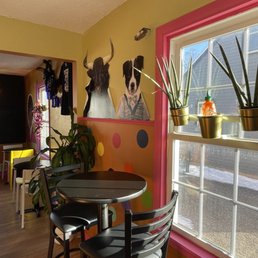 a table and chairs in a brightly colored room