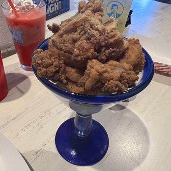 Salty Sisters Bar And Grill - Fried calamari appetizer - Bars Near Me - Cocoa Beach, Florida Salty Sisters Bar And Grill - Fried calamari appetizer - Bars Near Me - Cocoa Beach, Florida