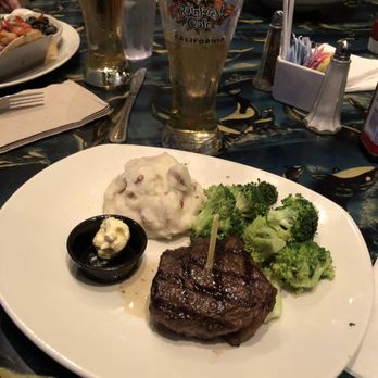 Rainforest Cafe - Sirloin Steak side of garlic butter , veggies and mashed - American Near Me - Ontario, California Rainforest Cafe - Sirloin Steak side of garlic butter , veggies and mashed - American Near Me - Ontario, California
