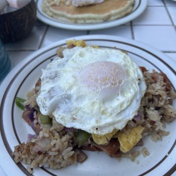 The Gazebo Restaurant - Fried rice with fried egg on top. Macadamia nut pancakes in the back - Breakfast & Brunch Near Me - Lahaina, Hawaii
