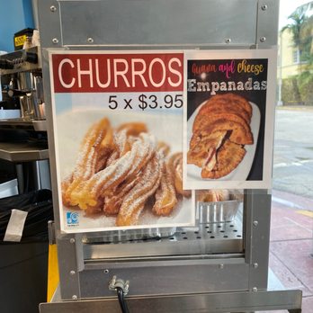 Las Olas Cafe - Churros and empanada sign - Cuban Near Me - Miami Beach, Florida
