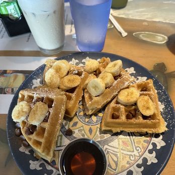 Mel’s Tiki Cafe - Waffles w Chocolate Chips and Bananas - Breakfast & Brunch Near Me - Indialantic, Florida Mel’s Tiki Cafe - Waffles w Chocolate Chips and Bananas - Breakfast & Brunch Near Me - Indialantic, Florida