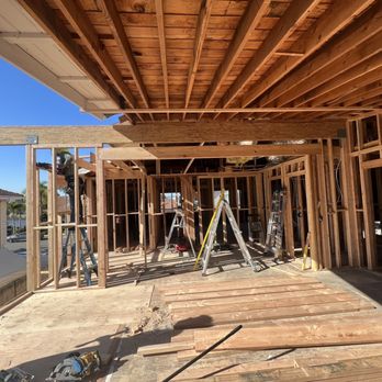 OC Side Construction And Design - a man working on a house - Cabinetry Near Me - Anaheim, California