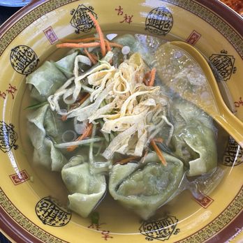 Dumpling Cafe - 34. Vegetarian Wonton Soup - A bowl of vegetarian wonton soup containing green dumplings, shredded vegetables, and crispy toppings, served in a decorative Chinese-style bowl. - Dim Sum Near Me - Santa Fe, New Mexico