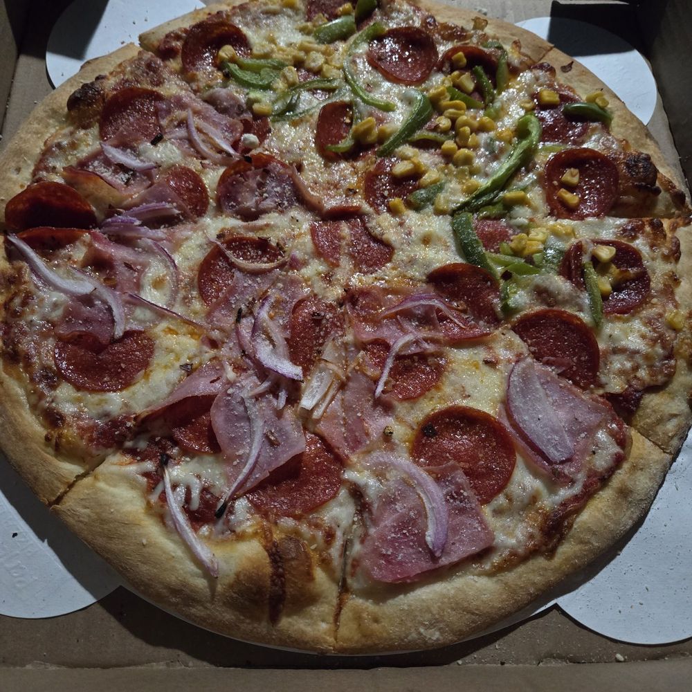 Pizza Station 826 - Pepperoni pizza with one half having onions and ham and the other half with bell peppers and corn. - Pizza Near Me - Hialeah, Florida Pizza Station 826 - Pepperoni pizza with one half having onions and ham and the other half with bell peppers and corn. - Pizza Near Me - Hialeah, Florida