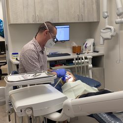 Surf Smiles Family Dentistry - 5 year old getting her teeth counted. Dr. Warner made it fun!