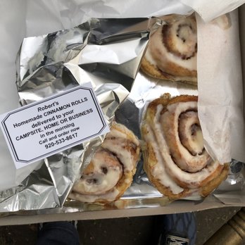 Roberts Homeade Cinnamon Rolls - a person standing next to a box of cinnamon rolls - Specialty Food Near Me Roberts Homeade Cinnamon Rolls - a person standing next to a box of cinnamon rolls - Specialty Food Near Me