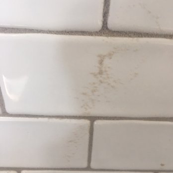 NME Builders - Grey grout clearly NOT cleaned from the tile. Just one example. - Roofing Near Me - New Albany, Ohio