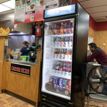 Taquería Mixtepec - a man sitting at a counter - Mexican Near Me - Greenville, South Carolina Taquería Mixtepec - a man sitting at a counter - Mexican Near Me - Greenville, South Carolina