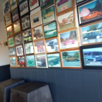 Paul Bunyan - a wall full of framed pictures - Burgers Near Me - Hayden, Idaho