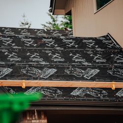 IronHead Roofing - Pride in every layer -- our branded water barrier paper shows our commitment to quality, precision, and protection.