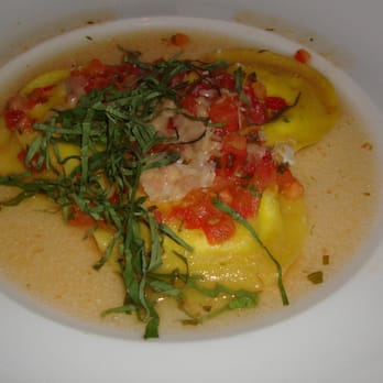 Seasons 52 - Sonoma goat cheese ravioli with tomato and basil in a light broth - New American Near Me - Jacksonville, Florida