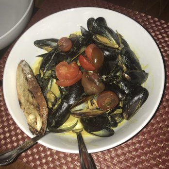 The Vesper - Mussel entree in a coconut curry - Cocktail Bars Near Me - Rochester, New York The Vesper - Mussel entree in a coconut curry - Cocktail Bars Near Me - Rochester, New York