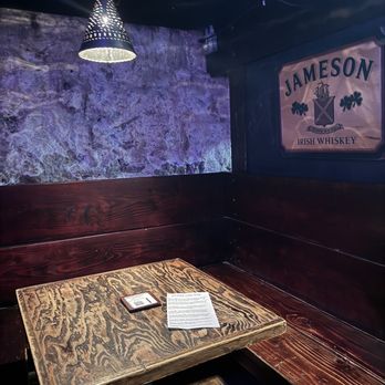 O'Malley's Pub - a wooden table with a menu on it - Irish Pub Near Me - Weston, Missouri O'Malley's Pub - a wooden table with a menu on it - Irish Pub Near Me - Weston, Missouri