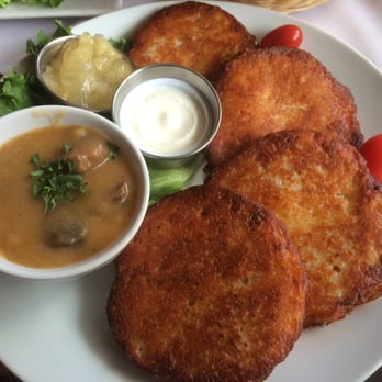 Cafe Polonia - Potato Pancakes with applesauce, sour cream, and delicious goulash. - Polish Near Me - Boston, Massachusetts Cafe Polonia - Potato Pancakes with applesauce, sour cream, and delicious goulash. - Polish Near Me - Boston, Massachusetts