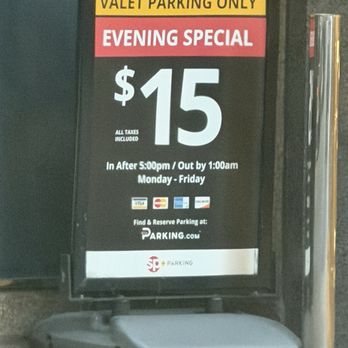 Converse Chicago Popup - A parking sign displays a $15 evening special rate at 120 East Walton, with details about hours, payment options, and reservation website. - Shoe Stores Near Me - Chicago, Illinois